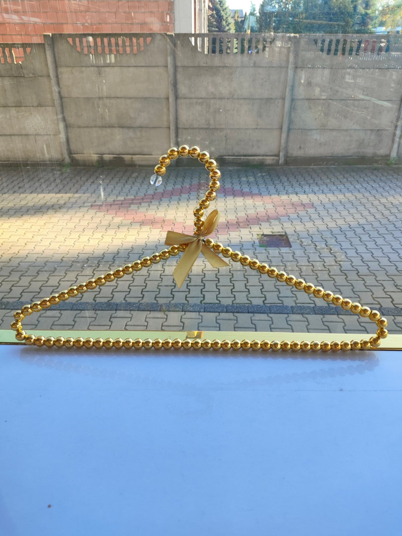 Percha de cuentas doradas 50 uds.